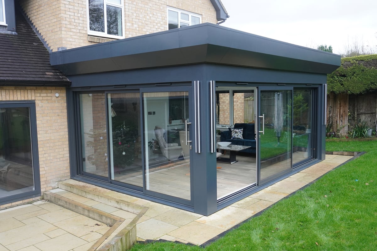 4700 Sliding Door System manufactured by Altegra, installed by Spire Glass.